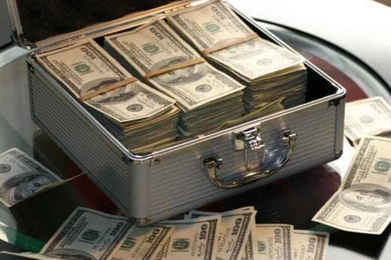 dollar banknotes in a suit case
