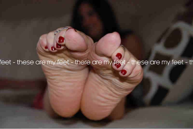 feet with nail painting and toe rings watermark
