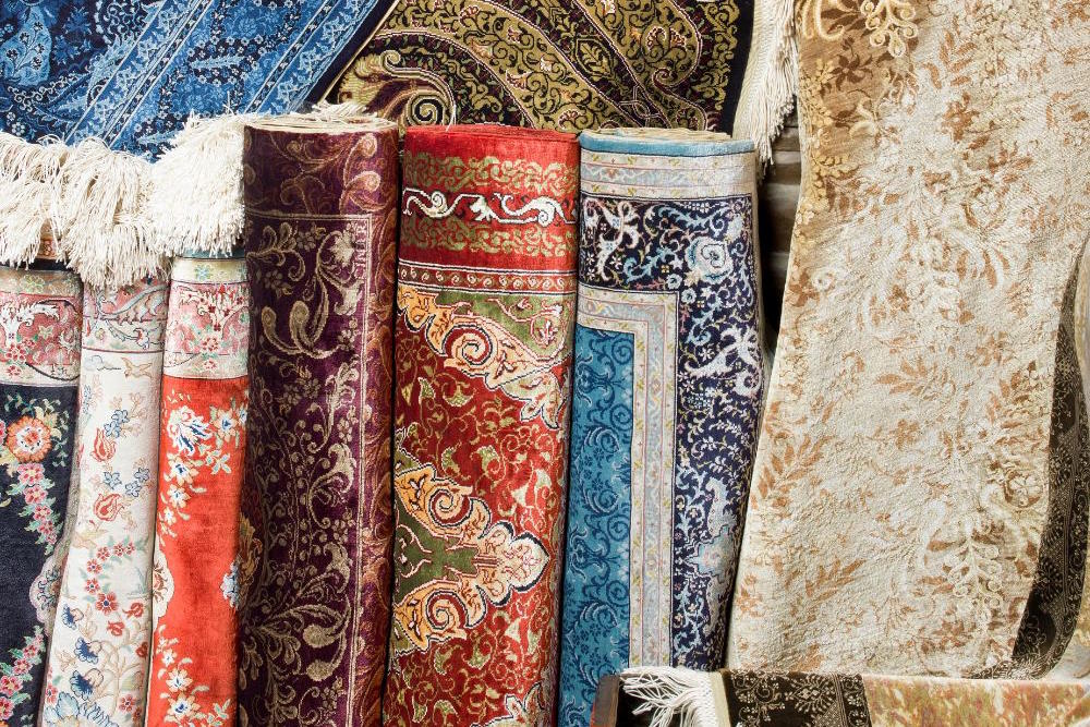 Image via Canva - rolled rugs